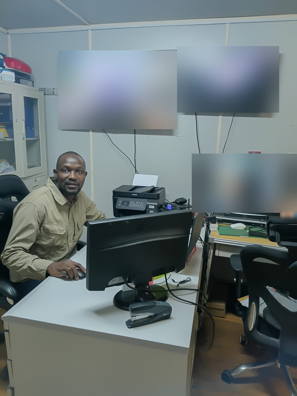 An operator in the operations room beneath the CCTV monitors