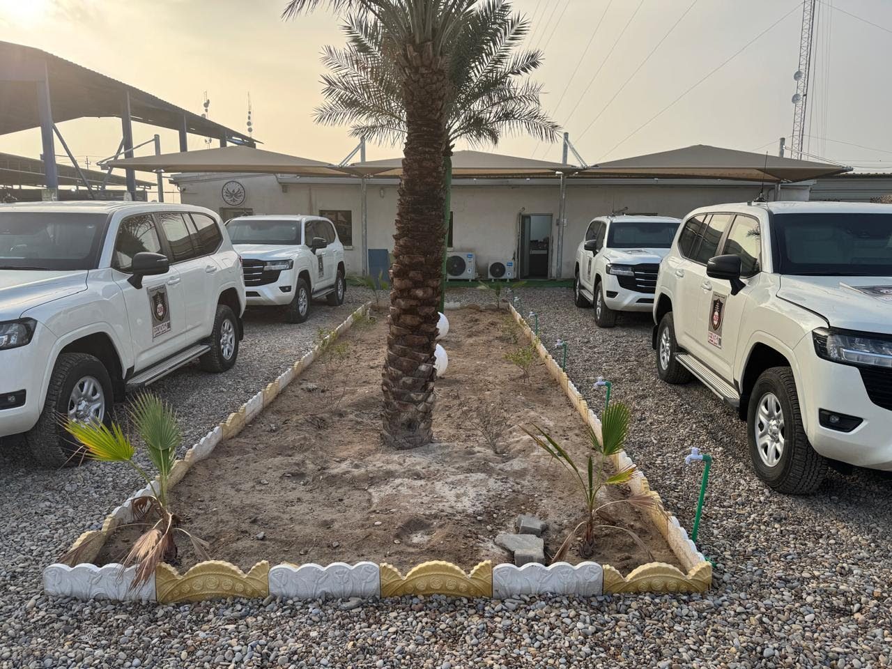 Diri Al-Nassir vehicles at the site at dusk