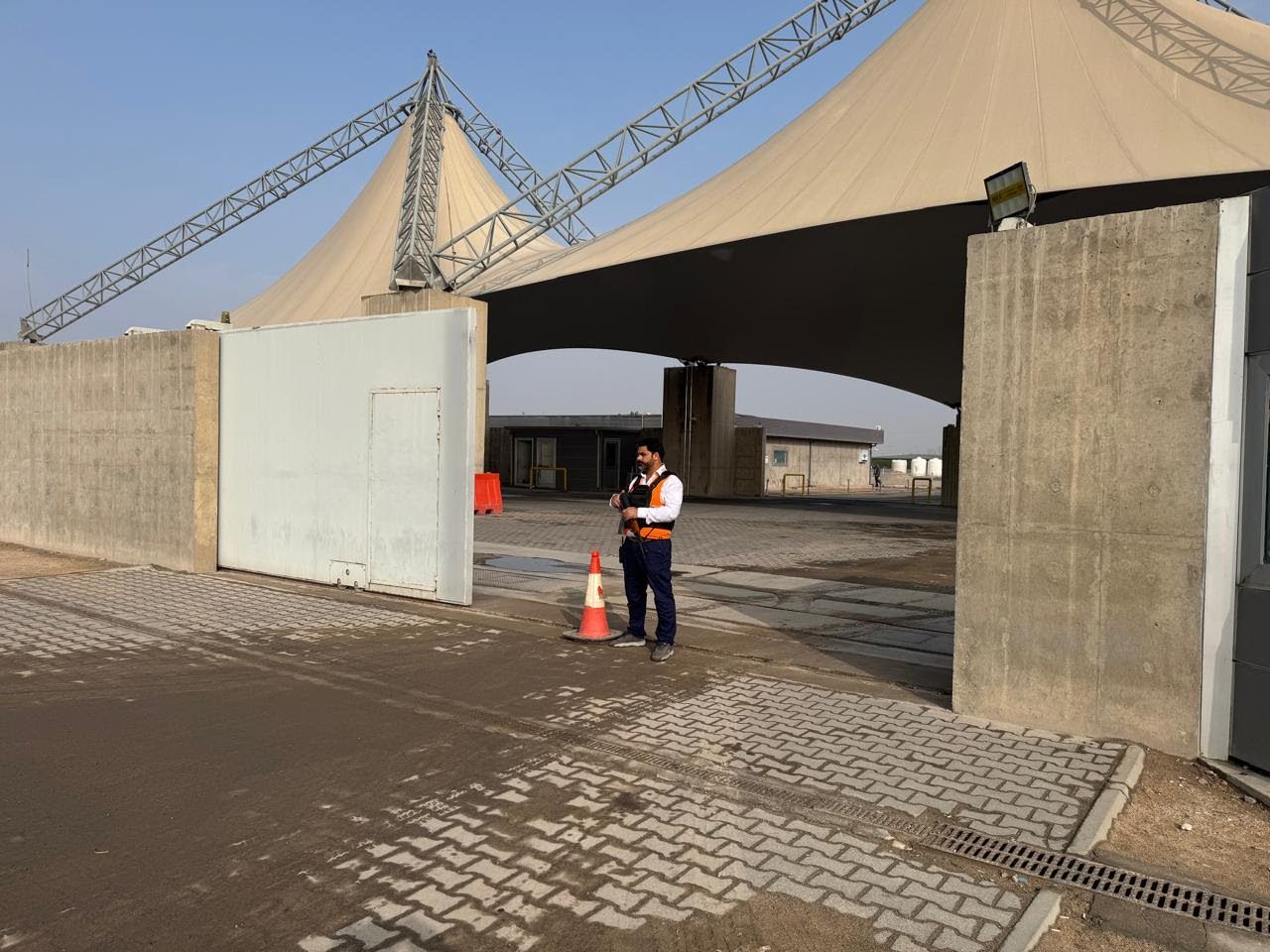 A guard at the Iraq Energy City main gate