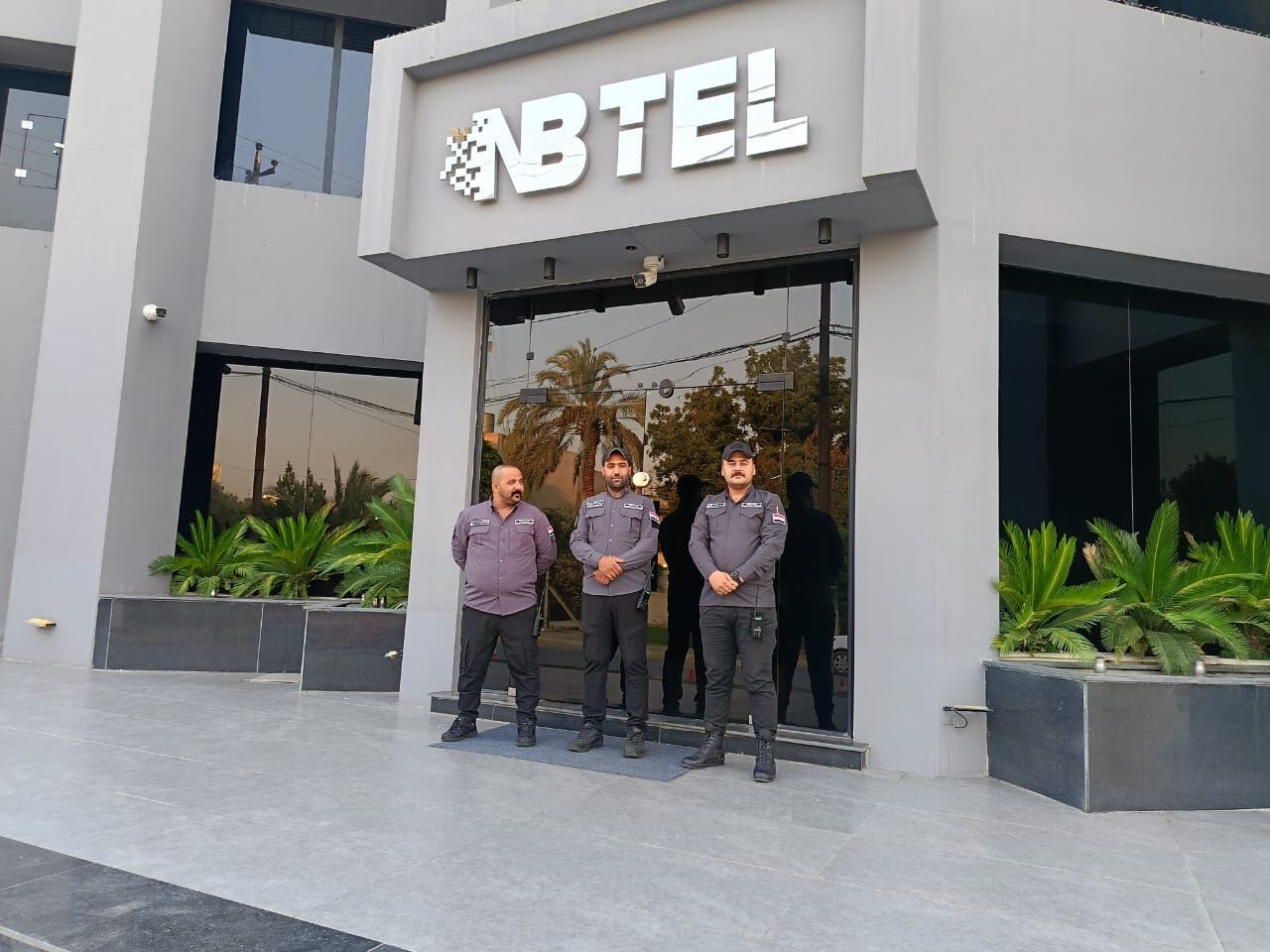 Diri Al-Nassir guard on post at the NBTel headquarters in Mosul