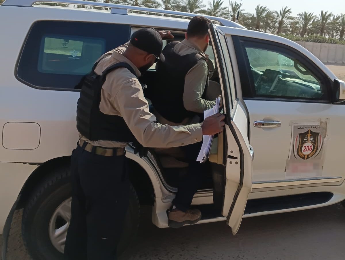 Protective detail escorting a client to the vehicle